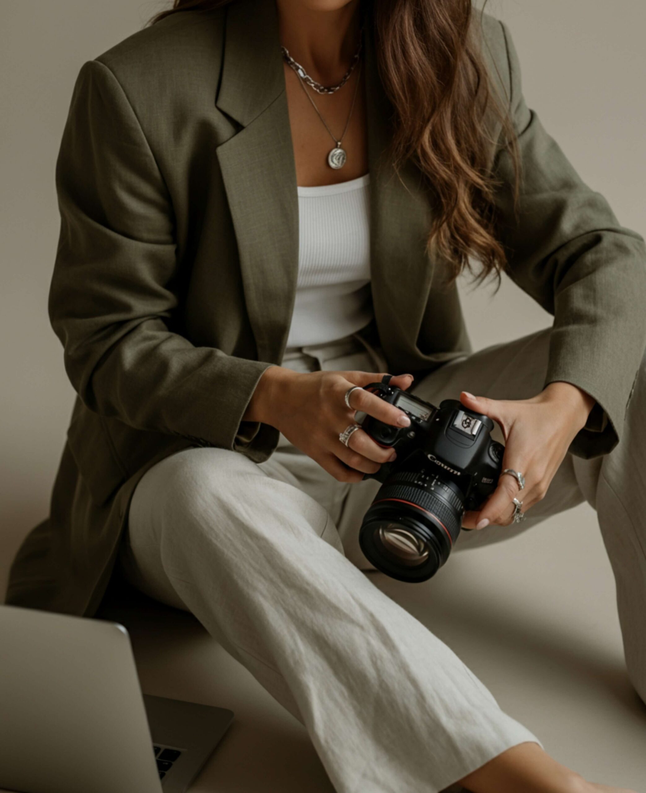 wedding photographer reviewing her website on a laptop